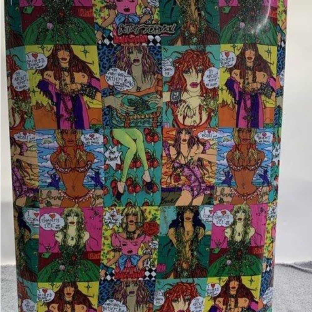Colorful Betsey Johnson Comic and cherries suitcase.